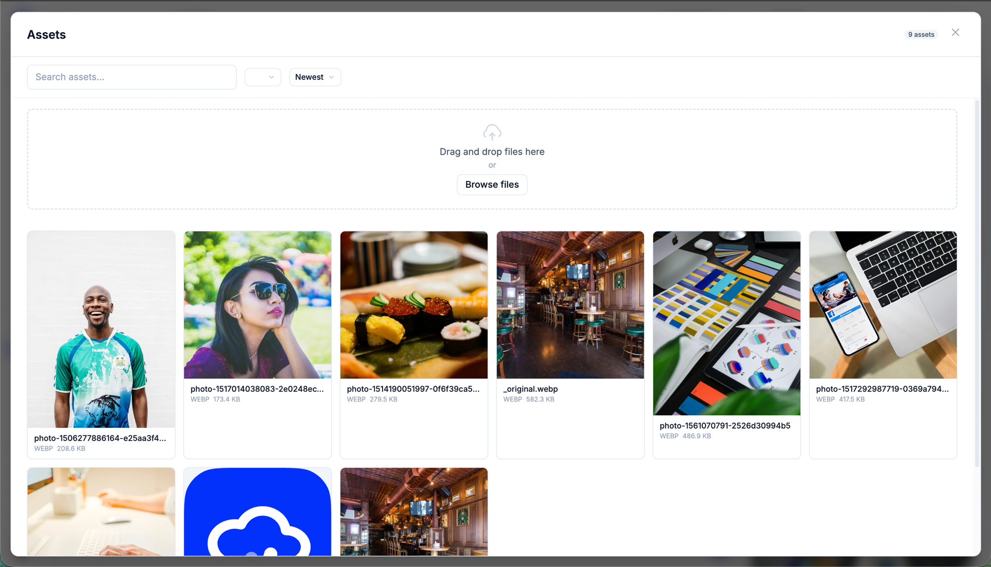The expanded media library: search and sort controls above a grid of assets showing format and size